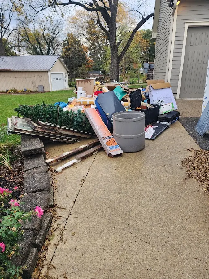 Dumpster being loaded with debris for 12 Yard Dumpster Rental in Berwick